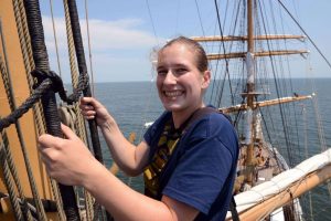 Irissa climbing up to the royal sails on the foremast of the USCGC EAGLE. Irissa Danke