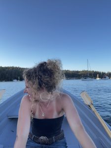 Leila sits on a row boat