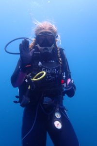 Jenna underwater in scuba diving gear
