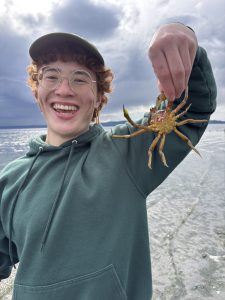 Spencer Hill holds a crab