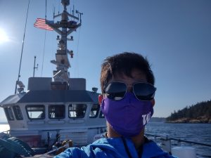 Dereck Cordova wearing a mask on a ship