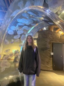 Megan Fellstrom stands in an aquarium