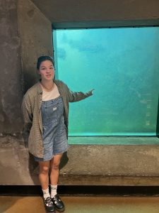 Lucy Kao points to a fish swimming through a fish ladder