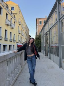 Julia Robidoux stands on a city street