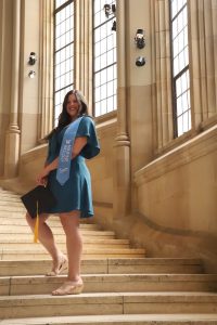 Ashley Rendon graduation photo on a staircase