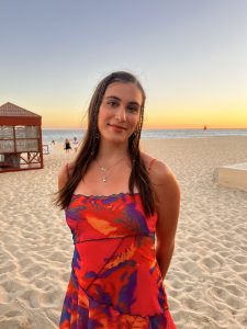 Alexis Twing stands on a beach
