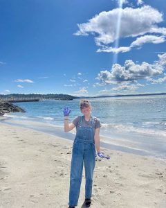 Kaelin Lindsey stands on a sunny beach