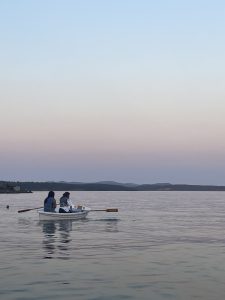 People on the water in a rowing boat