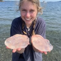 Student holding jelly fish