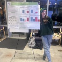 student with poster presentation