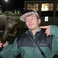 Student pointing to kelp