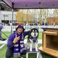 This is a photo of me with Dubs at a Husky football game! He's too cute to not be included