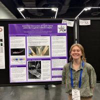 Student with research poster