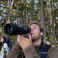Man with long lense camera