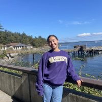 Student in UW shirt at FHL dock
