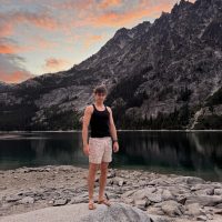 man in front of mountain