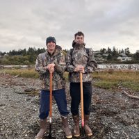 two people clam digging